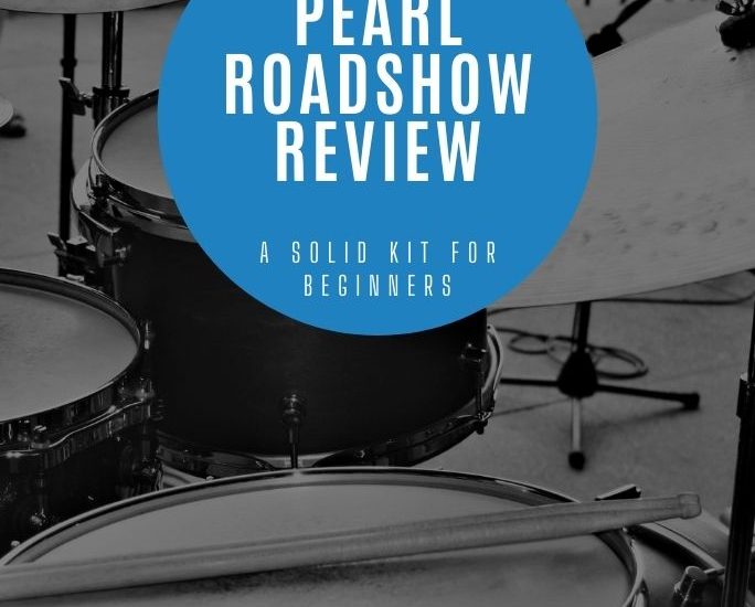 close-up view of a snare drum with drumsticks on top, with an overlay that reads, "Pearl Roadshow Review: A Solid Kit for Beginners""
